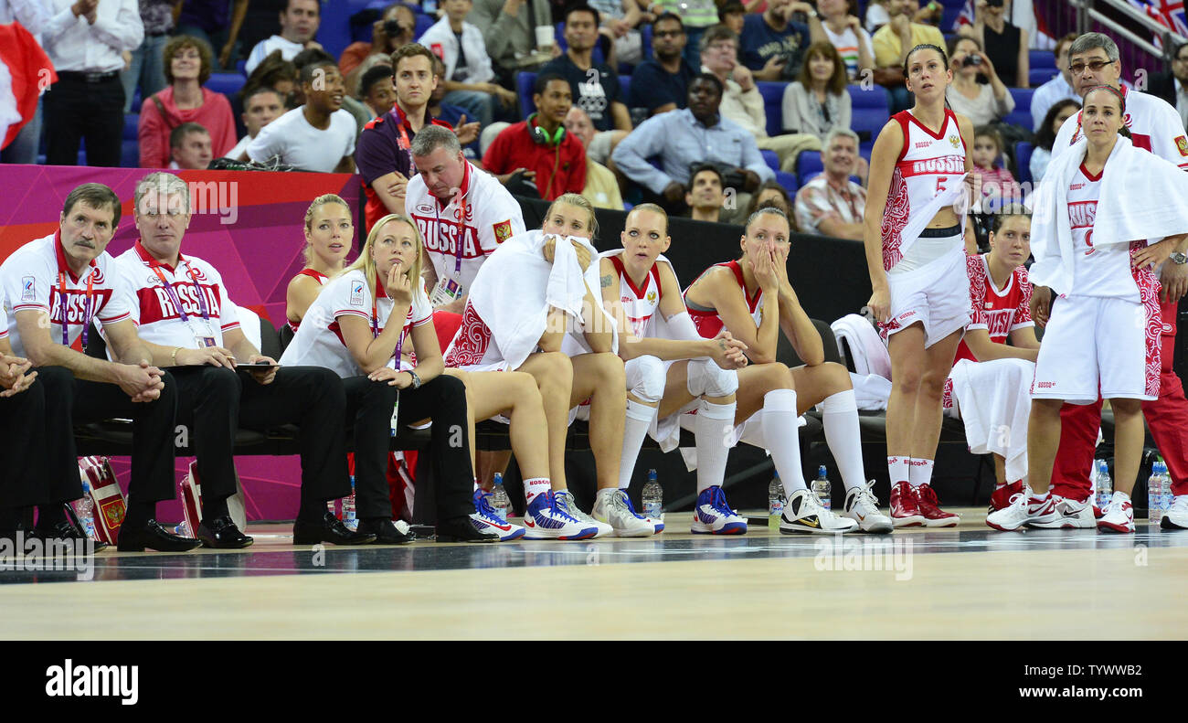 United States' Kevin Durant (C) and Kevin Love (R) cheer a foul on Spain's  Pau Gasol who knocked Chris Paul to the floor during the USA-Spain Men's  Basketball Gold Medal Medal game