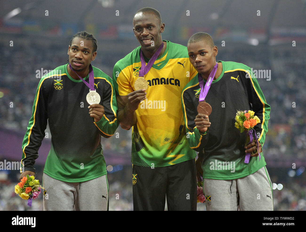 Silver Medalist Yohan Blake (LR), Gold Medalist Usain Bolt and Bronze