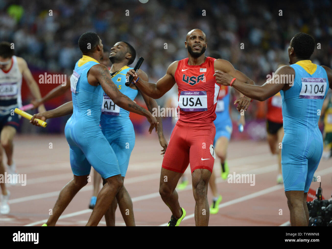 Angelo Taylor Of The Usa Looks To The Scoreboard As The Bahamian Relay Team Celebrates Winning The Gold In The Men S 4x400 Relay At The London 12 Summer Olympics On August 10