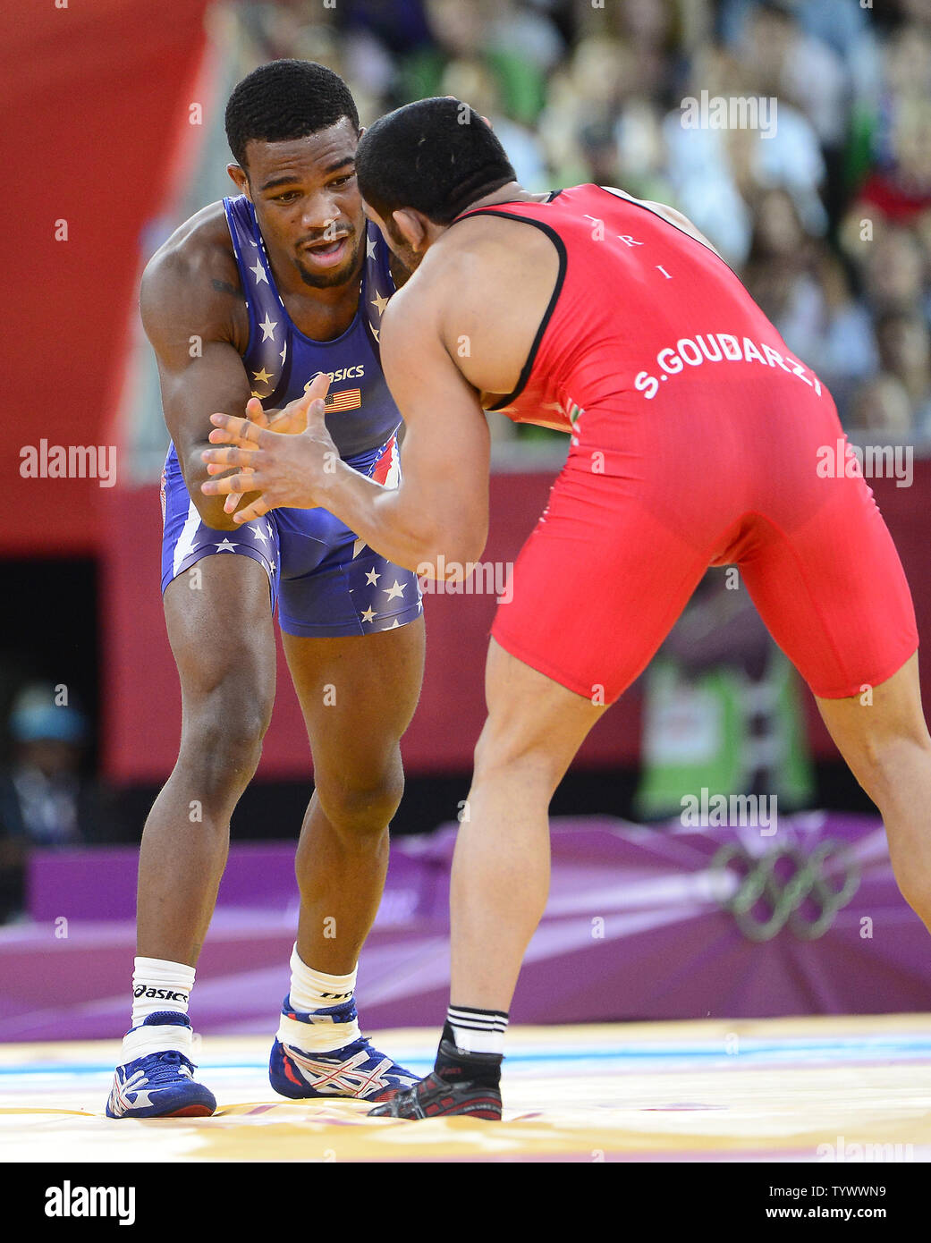 Jordan Ernest Burroughs of the United States of America, left, competes for a Gold Medal with Sadegh Saeed Goudarzi of Iran, right, in the Men's 74kg Freestyle Wrestling at the London 2012 Summer Olympics on August 10, 2012 in London. Burroughs won the match and the Gold.   UPI/Ron Sachs Stock Photo