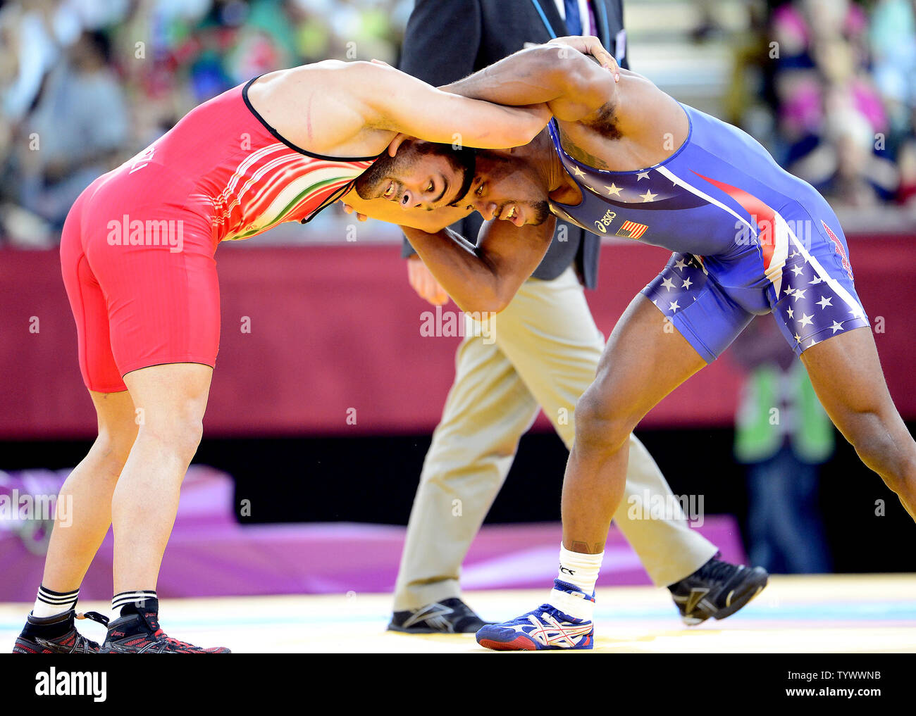 Jordan Ernest Burroughs of the United States of America, right, competes for a Gold Medal with Sadegh Saeed Goudarzi of Iran, left, in the Men's 74kg Freestyle Wrestling at the London 2012 Summer Olympics on August 10, 2012 in London. Burroughs won the match and the Gold.   UPI/Ron Sachs Stock Photo