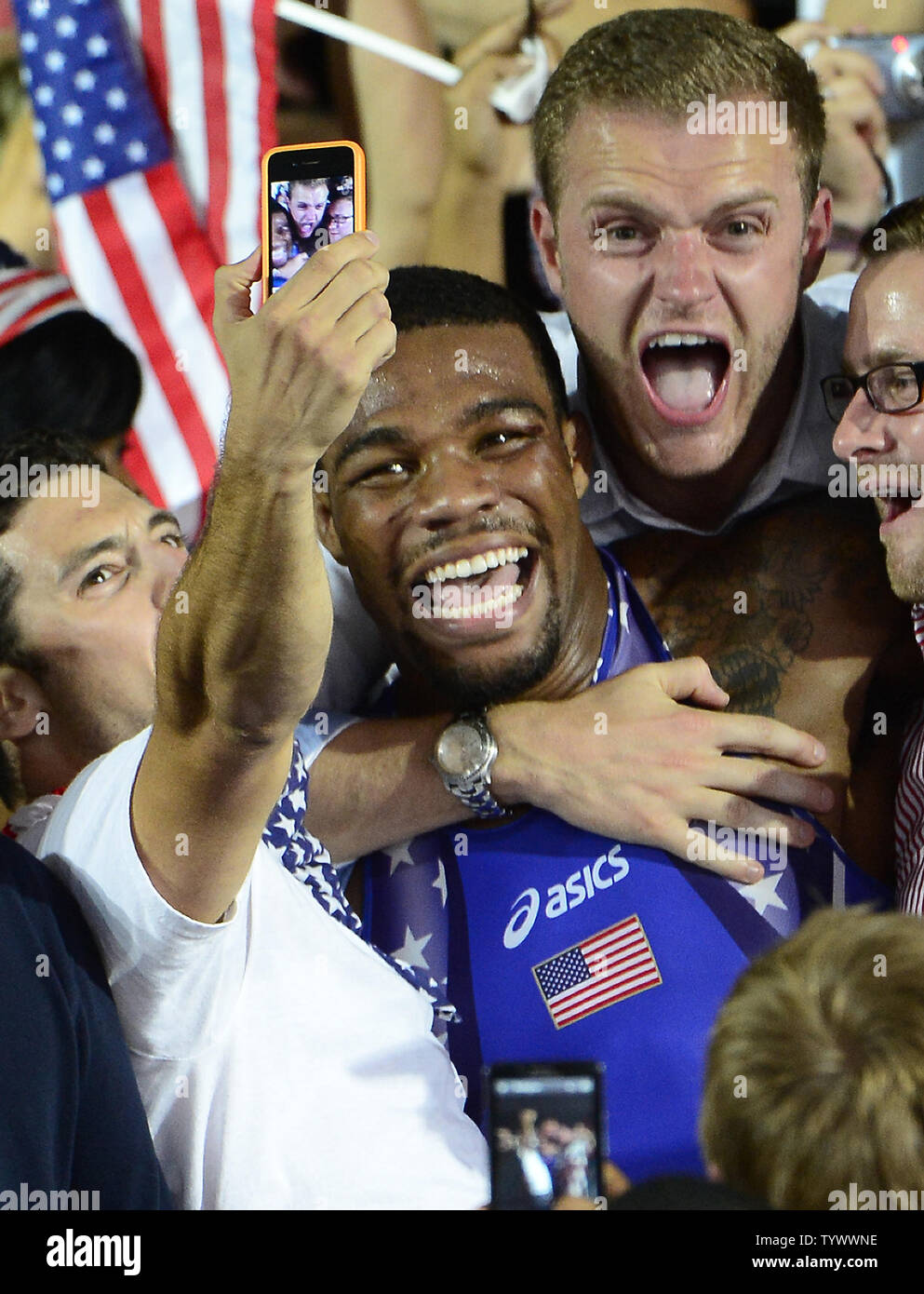 Jordan Ernest Burroughs of the United States of America celebrates with fans in the crowd after winning the Gold Medal in the Men's 74kg Freestyle Wrestling against Sadegh Saeed Goudarzi of Iran at the London 2012 Summer Olympics on August 10, 2012 in London.  UPI/Ron Sachs Stock Photo