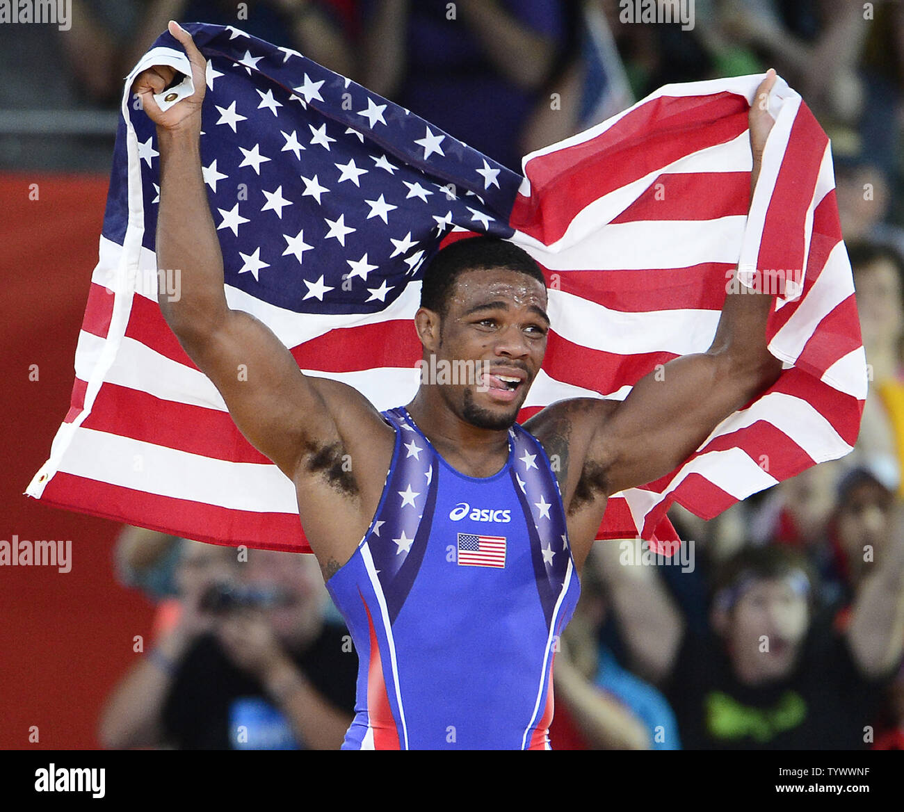 Jordan Ernest Burroughs of the United States of America celebrates after winning the Gold Medal in the Men's 74kg Freestyle Wrestling against Sadegh Saeed Goudarzi of Iran at the London 2012 Summer Olympics on August 10, 2012 in London. UPI/Ron Sachs Stock Photo