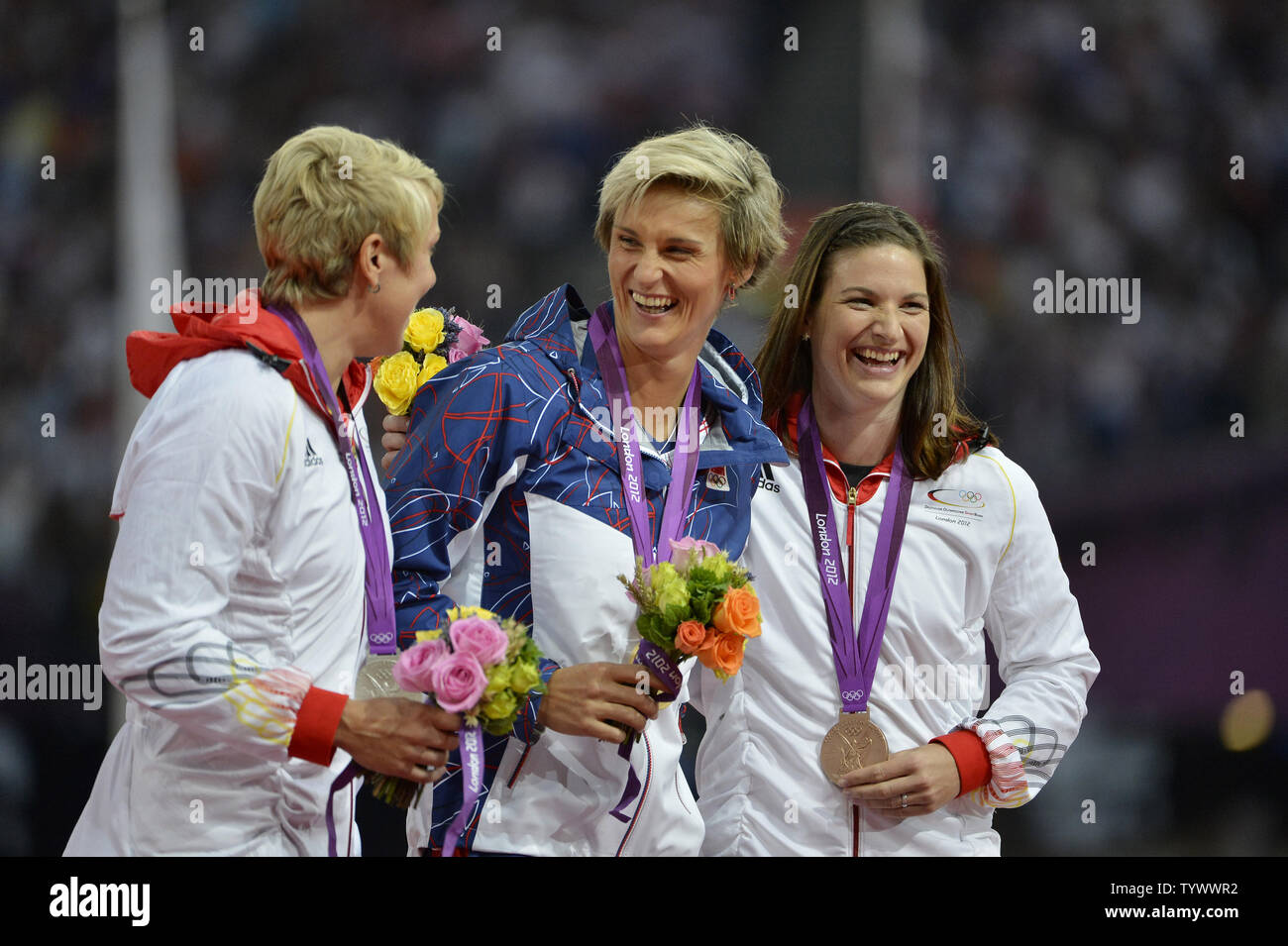 Silver Medalist Christina Obergfoll of Germany, (L-R) Gold Medalist Barbora Spotakova of the Czech Republic and Linda Stahl of Germany laugh during the Victory Ceremony for the Women's Javelin Throw at the London 2012 Summer Olympics on August 10, 2012 in Stratford, London. Spotakova won Gold with a throw of 69.55M while Obergfoll hit a mark of 65.16 and Stahl threw a season-best 64.91 in the final.      UPI/Brian Kersey Stock Photo