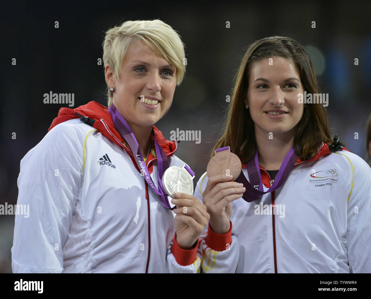 Silver Medalist Christina Obergfoll of Germany (L)  and teammate Linda Stahl hold their medals during the Victory Ceremony for the Women's Javelin Throw at the London 2012 Summer Olympics on August 10, 2012 in Stratford, London. Obergfoll hit a mark of 65.16 and Stahl threw a season-best 64.91 in the final.      UPI/Brian Kersey Stock Photo