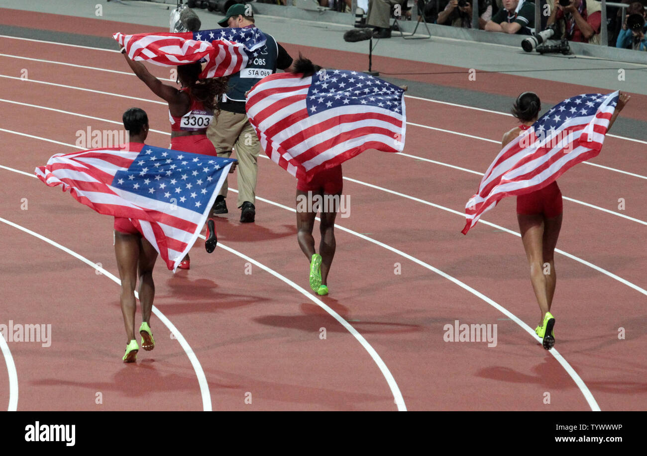 America's Women's Relay team do a lap of honour after acheiving a new