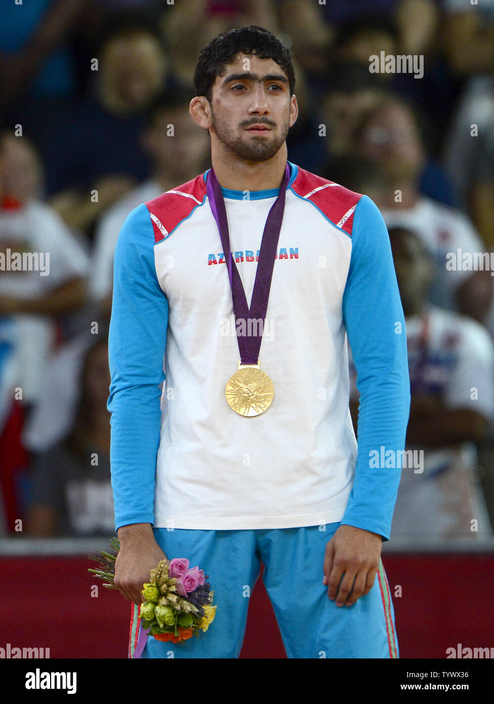 Toghrul Asgarov of Azerbaijan listens to his country's national anthem after winning the Gold Medal in the Men's 60kg Freestyle Wrestling at the London 2012 Summer Olympics on August 10, 2012 in London.   UPI/Ron Sachs Stock Photo