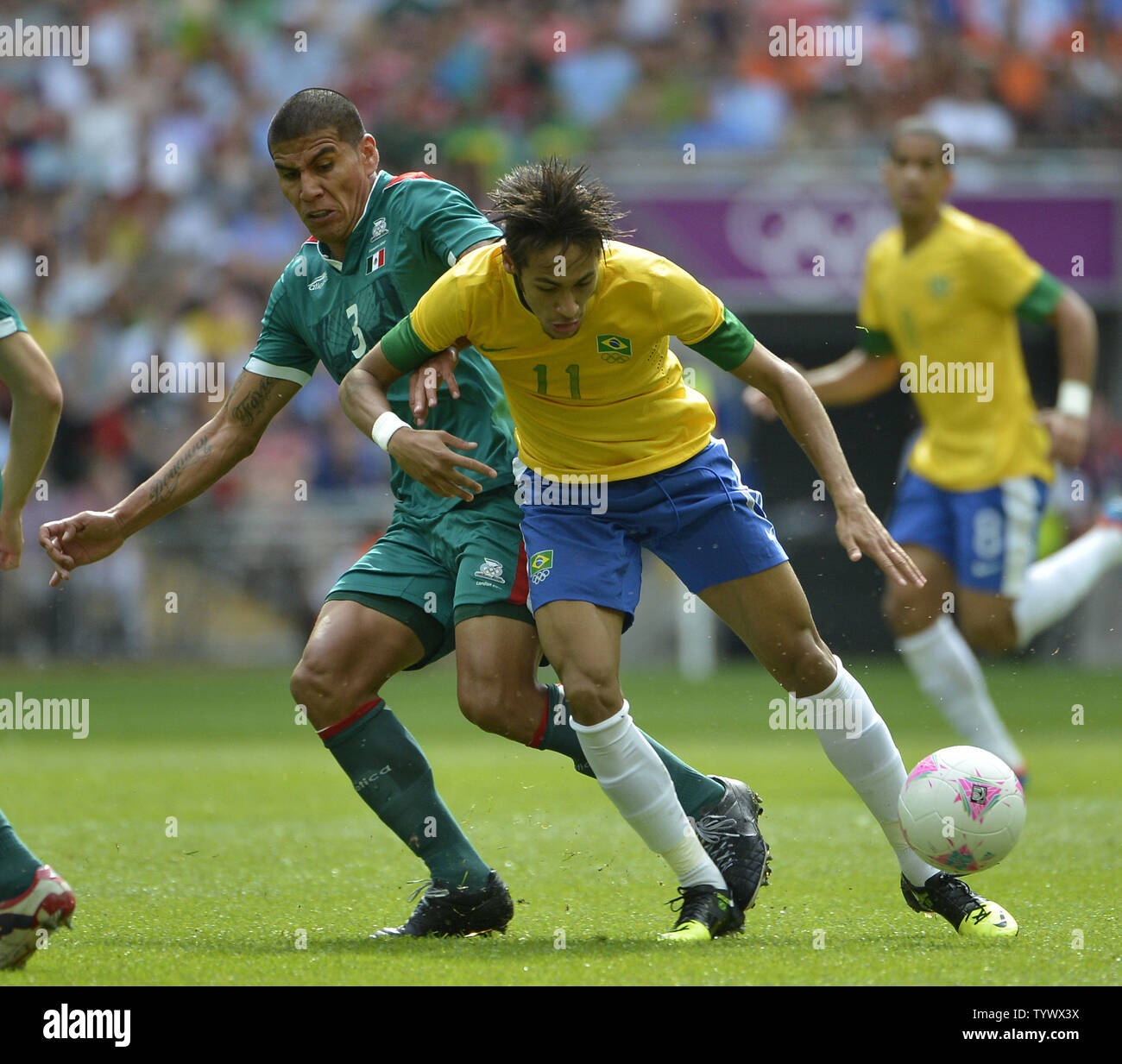 Defender Carlos Salcido of Mexico knocks forward Neymar of Brazil off the ball during the second half of the Gold Medal Football Match at the London 2012 Summer Olympics on August 11, 2012 at Wembley Stadium, London. Mexico defeated Brazil 2-1 to win the Gold Medal.      UPI/Brian Kersey Stock Photo