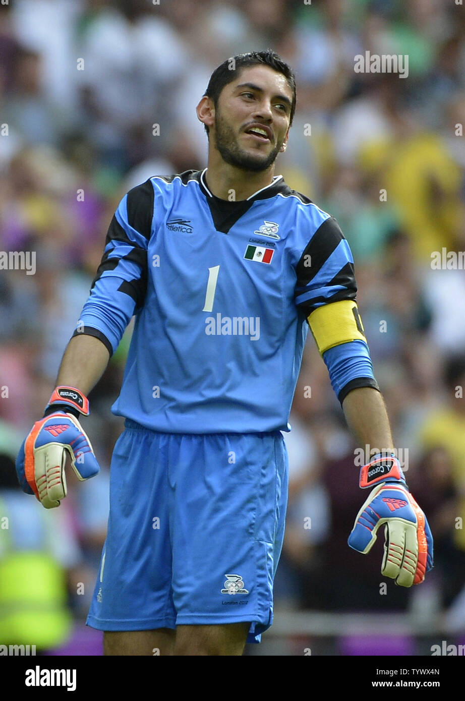 goalkeeper Jose Corona of Mexico smiles after defeating Brazil in the Gold Medal Football Match at the London 2012 Summer Olympics on August 11, 2012 at Wembley Stadium, London. Mexico defeated Brazil 2-1 to win the Gold Medal.      UPI/Brian Kersey Stock Photo