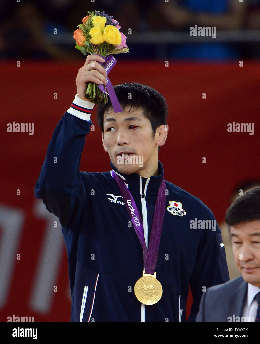 Tatsuhro Yonemitsu of Japan acknowledges the cheers of the crowd after receiving the Gold Medal in the Men's 66kg Freestyle Wrestling at the London 2012 Summer Olympics on August 12, 2012 in London.    UPI/Ron Sachs Stock Photo