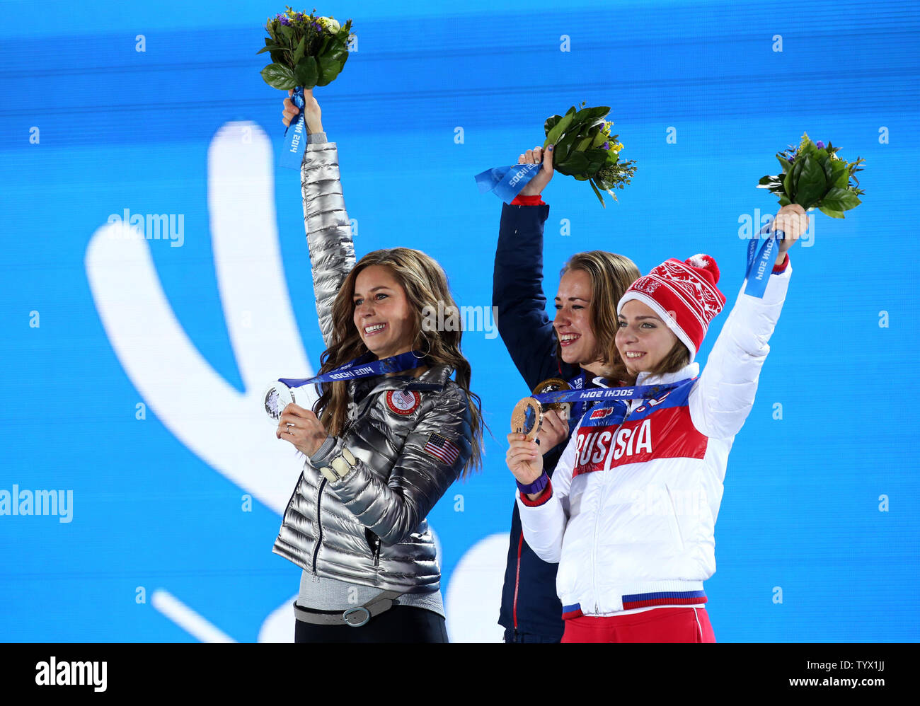 (From L to R) US athlete silver medalist Noelle Pikus-Pace, Great Britain's gold medalist Elizabeth Yarnold and Russia's bronze medalist Elena Nikitina jubilate during the medal ceremony for the women skeleton during the Sochi Winter Olympics on February 15, 2014.  UPI/Maya Vidon-White Stock Photo