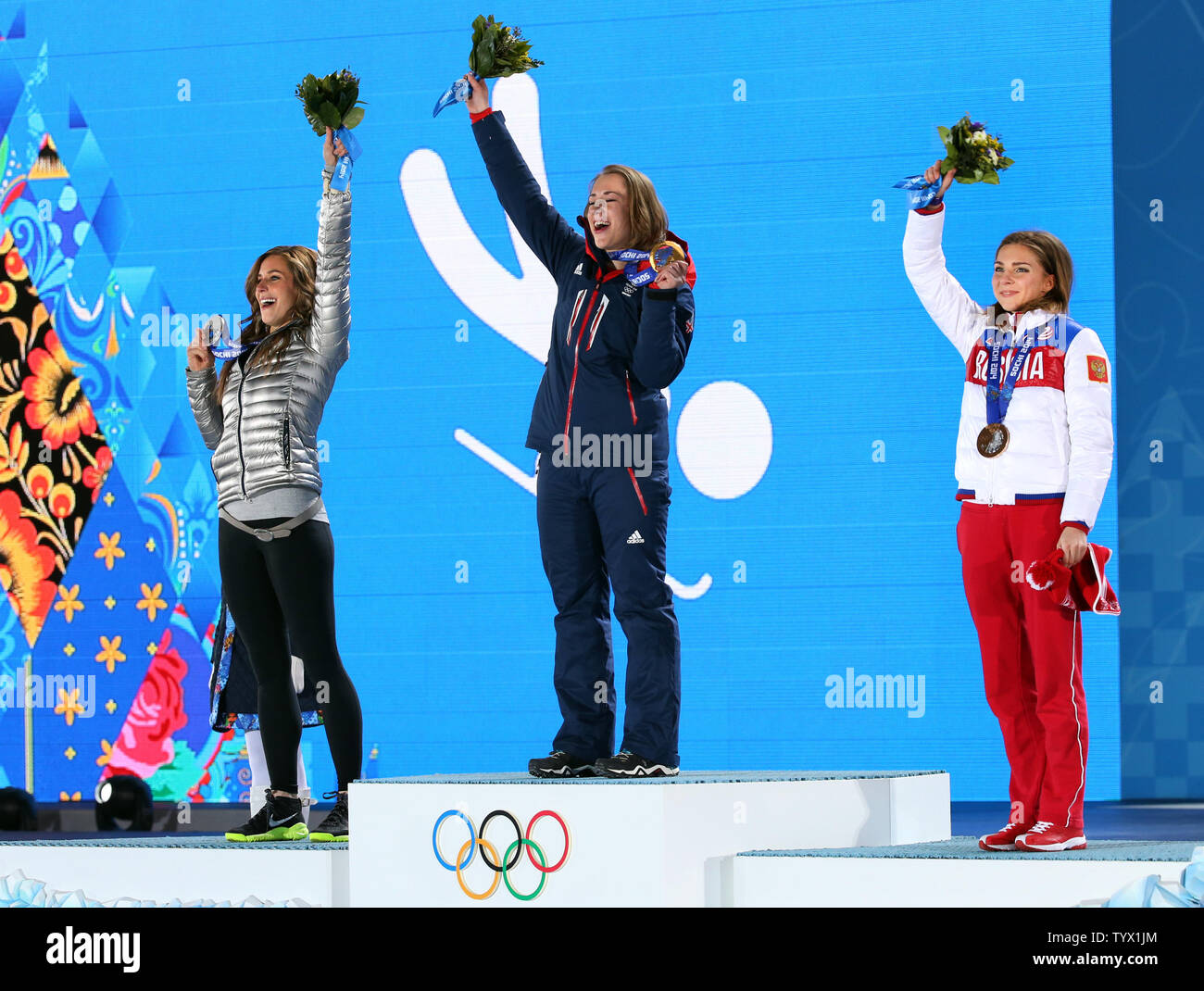 (From L to R) US athlete silver medalist Noelle Pikus-Pace, Great Britain's gold medalist Elizabeth Yarnold and Russia's bronze medalist Elena Nikitina jubilate during the medal ceremony for the women skeleton during the Sochi Winter Olympics on February 15, 2014.  UPI/Maya Vidon-White Stock Photo