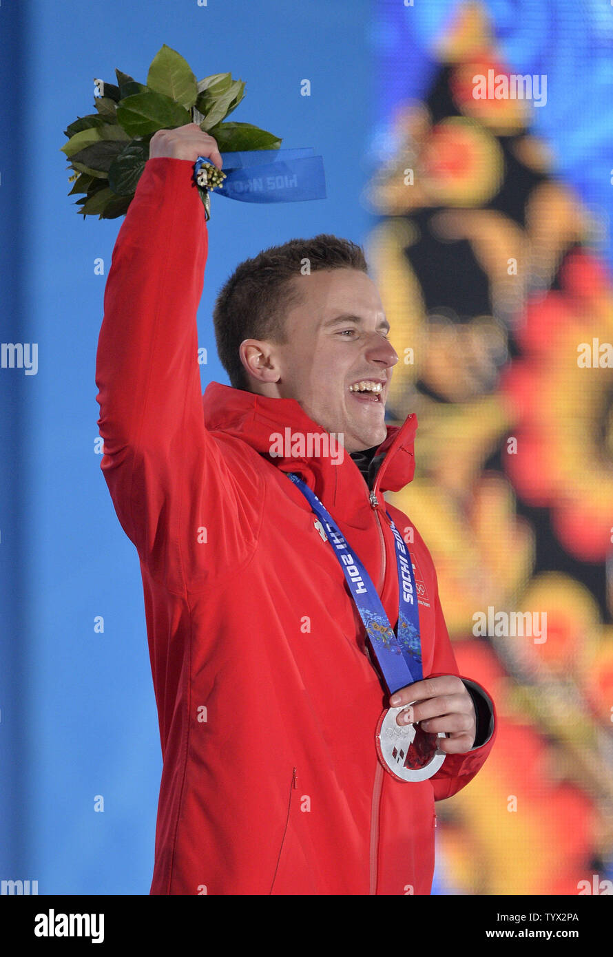 Switzerland's Nevin Galmarini celebrates his silver medal during the victory ceremony for men's snowboard parallel giant slalom at the Sochi 2014 Winter Olympics on February 19, 2014 in Sochi, Russia.     UPI/Brian Kersey Stock Photo