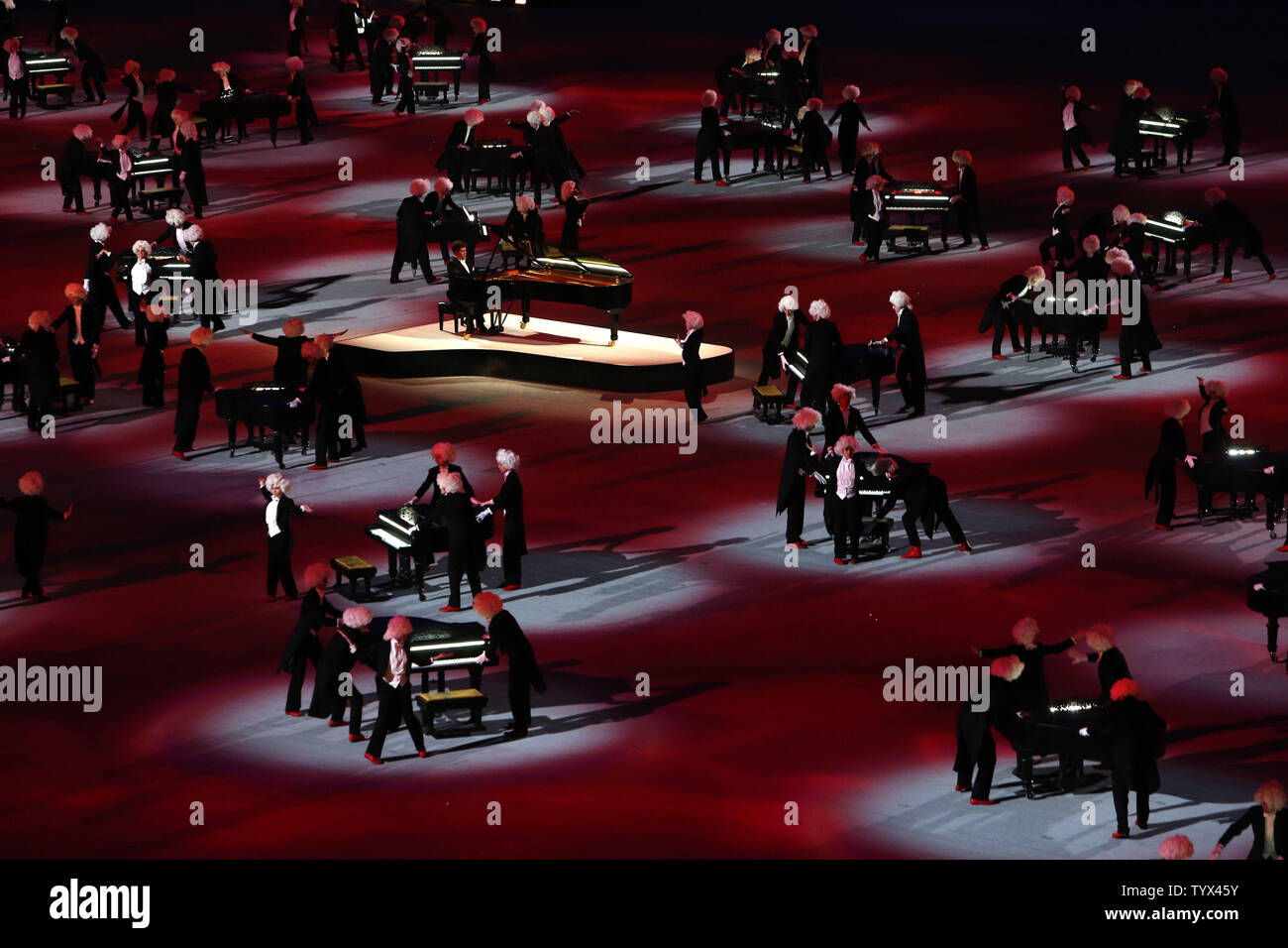 Pianist Denis Matsuev performs amid actors pushing 62 pianos around the(00)