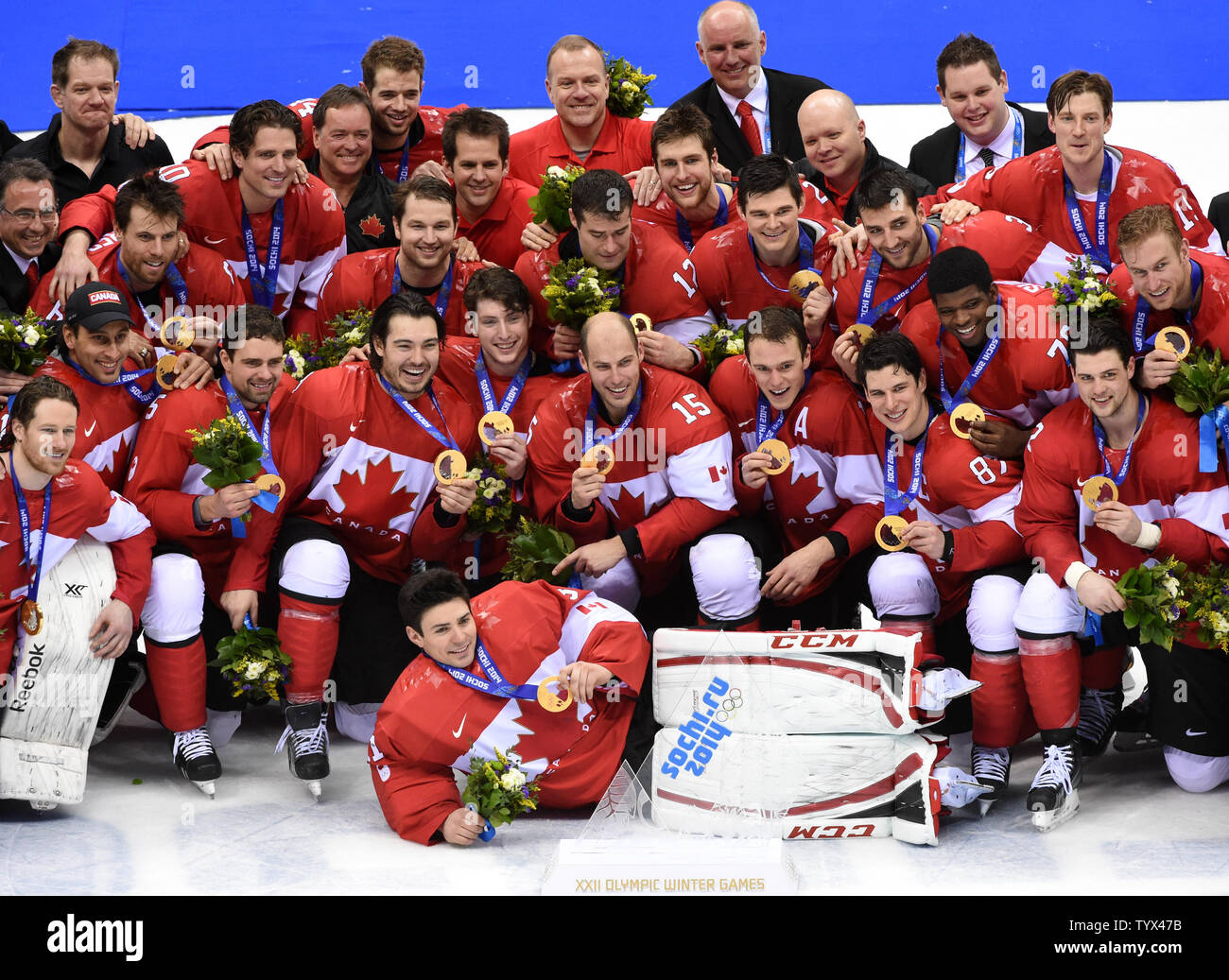 Members of the Canadian olympic hockey team pose for a photo with their  gold medals after defeating Sweden at the Sochi 2014 Winter Olympics on  February 23, 2014 in Sochi, Russia. Canada