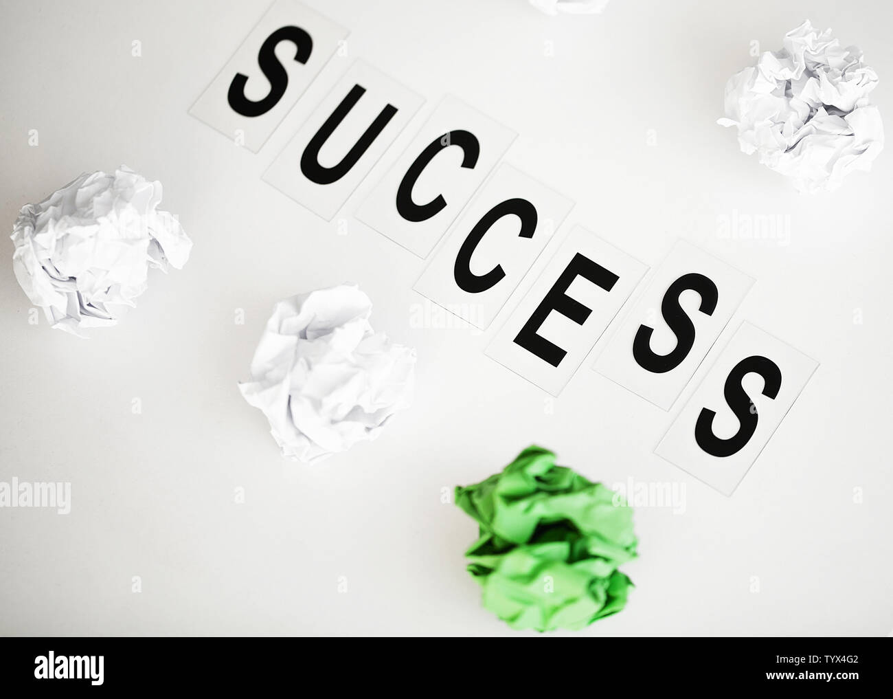 Success word written on white table. Copy space Stock Photo