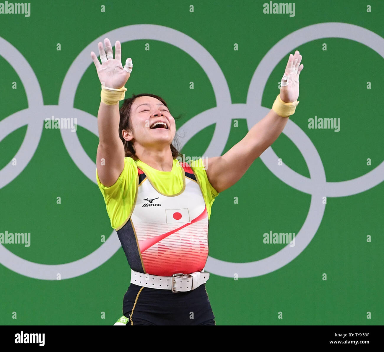 Japan's Hiromi Miyake celebrates a lift in the Clean and Jerk  portion of the Women's 48 Kg Weightlifting at the 2016 Rio Summer Olympics in Rio de Janeiro, Brazil, August 6, 2016. Miyake took the bronze medal to be the first woman to win medals in two Olympics in the weight class.  Photo by Terry Schmitt/UPI Stock Photo