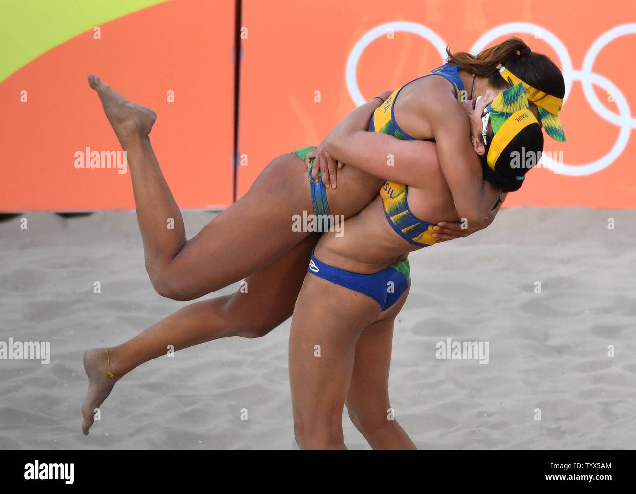 Brazil's Barbara Seixas and Agatha Rippel celebrate after defeating the Czech Republic during their preliminary beach volleyball game in the 2016 Rio Summer Olympics in Rio de Janeiro, Brazil, August 6, 2016. Photo by Kevin Dietsch/UPI Stock Photo