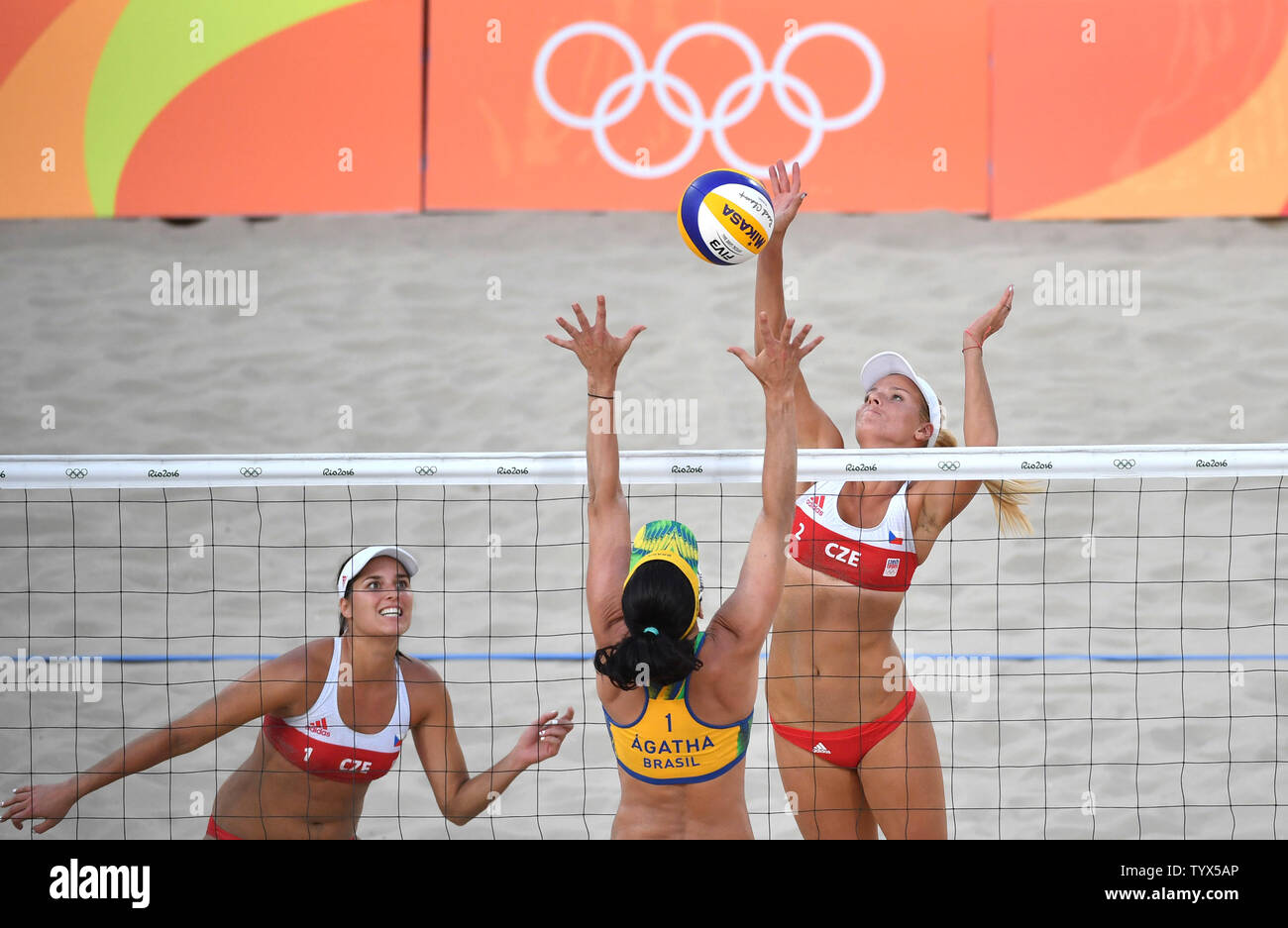Czech Republic's Marketa Slukova (R) and Barbora Hermannova return the ball against  Brazil's Agatha Rippel during their preliminary beach volleyball game in the 2016 Rio Summer Olympics in Rio de Janeiro, Brazil, August 6, 2016. Photo by Kevin Dietsch/UPI Stock Photo