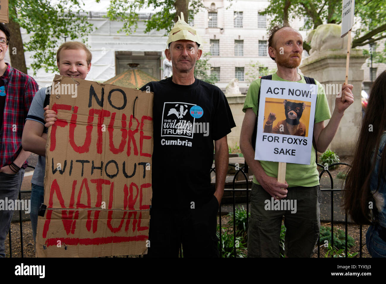 Environmental protesters hold placards during the demonstration.Environmental protesters gathered around Westminster to lobby politicians and tell them that actions need to be done for climate and environment. They also demanded the MP’s to pass new laws to reduce emissions and tackle plastic pollution. Stock Photo