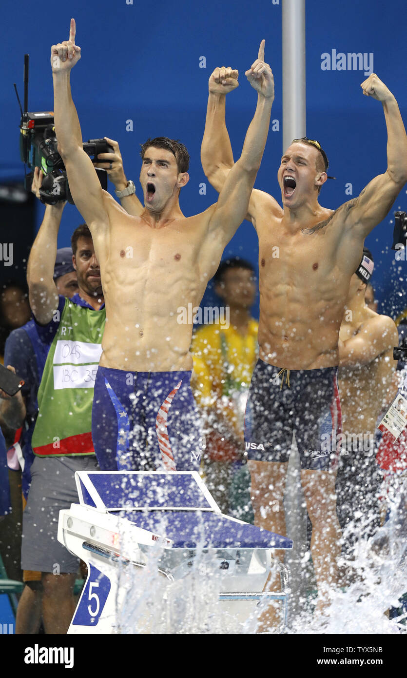 Americans Michael Phelps (L) and Caeleb Dressel celebrate winning gold