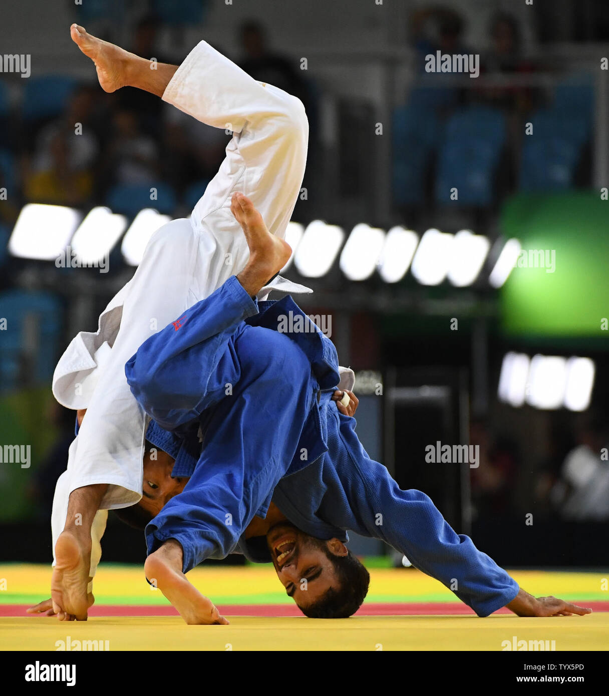 Antoine Bouchard of Canada puts his head to the mat fighting with Tumurkhuleg Davaadorj of Mongolia in 66KG Judo at the 2016 Rio Summer Olympics in Rio de Janeiro, Brazil, on August 7, 2016. Bouchard won the match.  Photo by Terry Schmitt/UPI Stock Photo