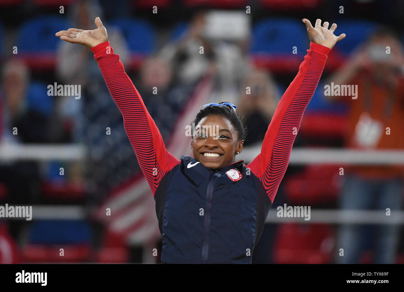 Simone Biles of the United States raises her hands in the air at the medal ceremony after the Women's Individual all around in artistic gymnastics at HSBC Arena (Arena Ol’mpica do Rio) at the 2016 Rio Summer Olympics in Rio de Janeiro, Brazil, on August 11, 2016. Simone Biles of the United States won the gold.    Photo by Terry Schmitt/UPI Stock Photo