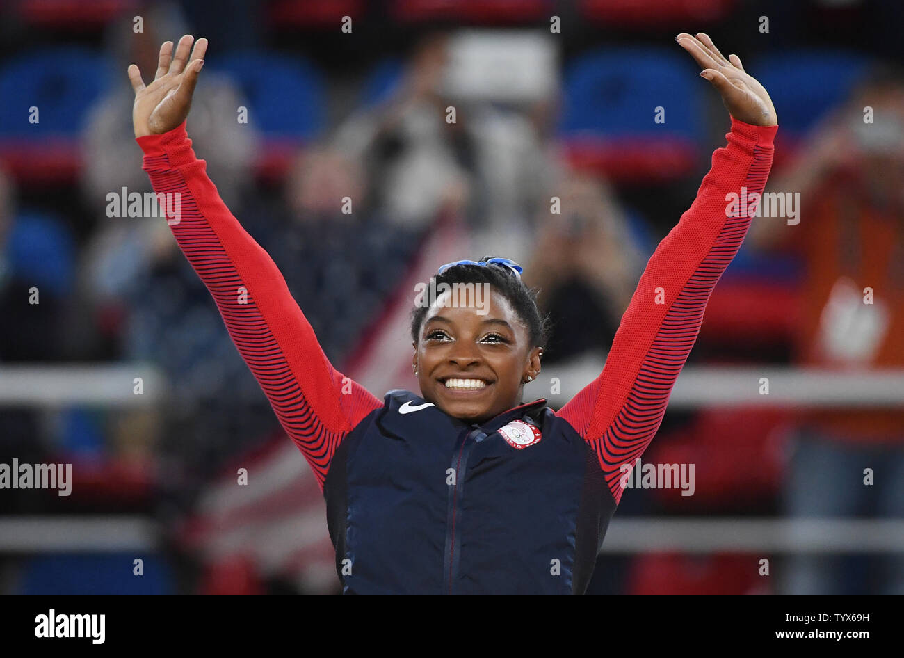 Simone Biles of the United States raises her hands in the air at the medal ceremony after the Women's Individual all around in artistic gymnastics at HSBC Arena (Arena Ol’mpica do Rio) at the 2016 Rio Summer Olympics in Rio de Janeiro, Brazil, on August 11, 2016. Simone Biles of the United States won the gold.    Photo by Terry Schmitt/UPI Stock Photo