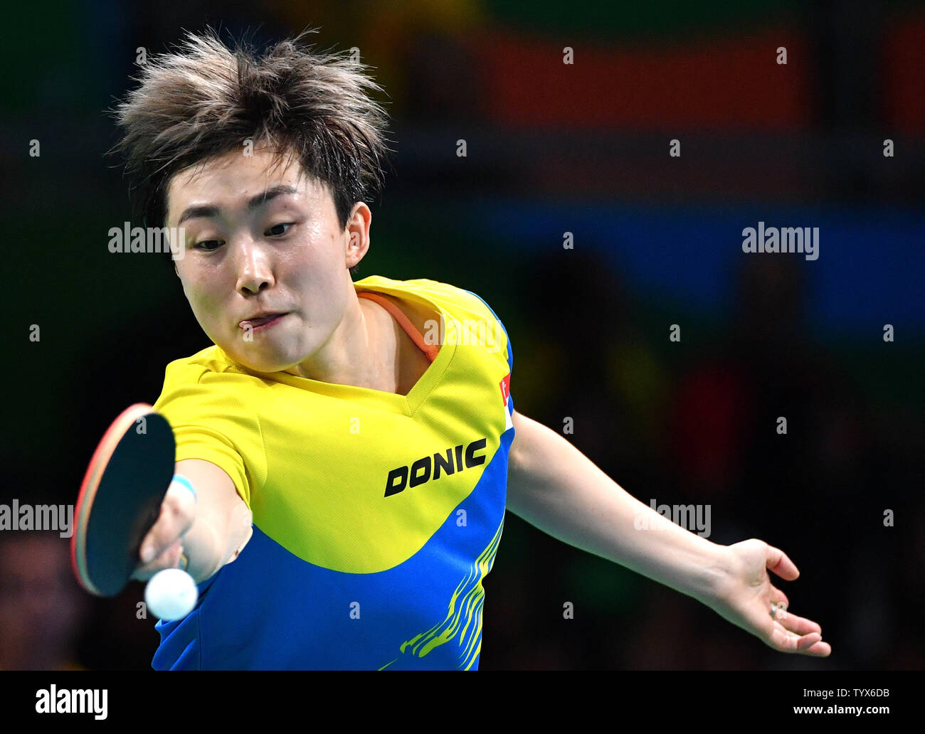 Singapore's Feng Tianwei returns the ball to Australia's Liu Jia during