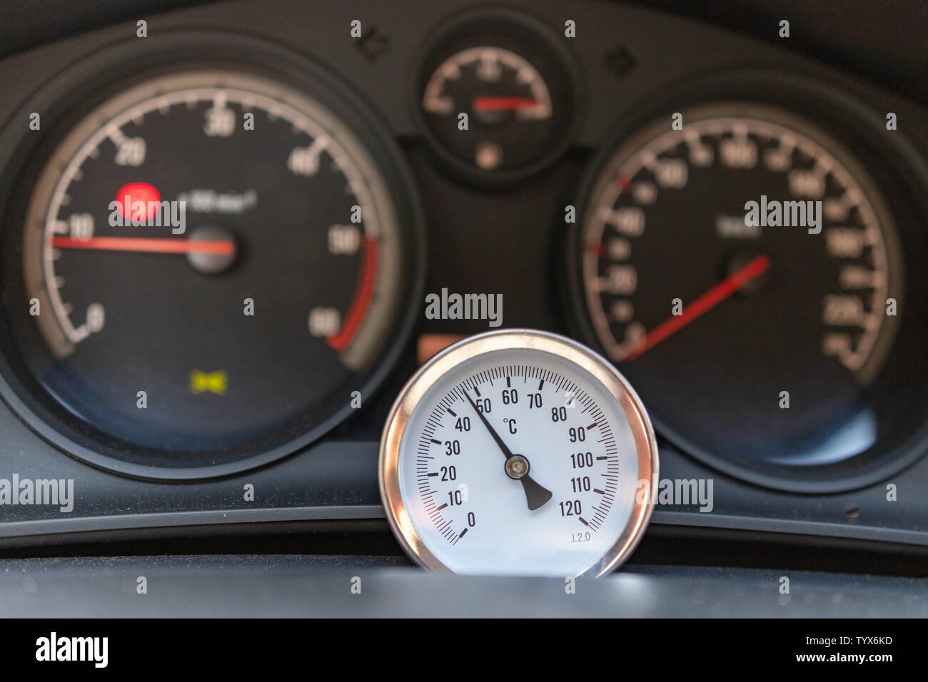 An independent thermometer showing the temperature in the car. High  temperature in the middle of the car. Season of the summer Stock Photo -  Alamy