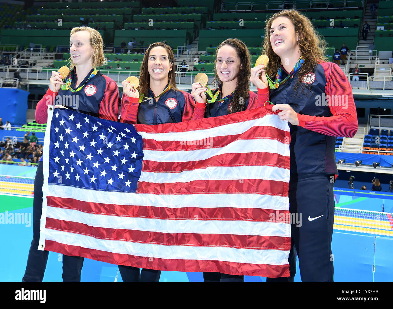 Team USA celebrates their gold medal in the Women's 4x200 Freestyle