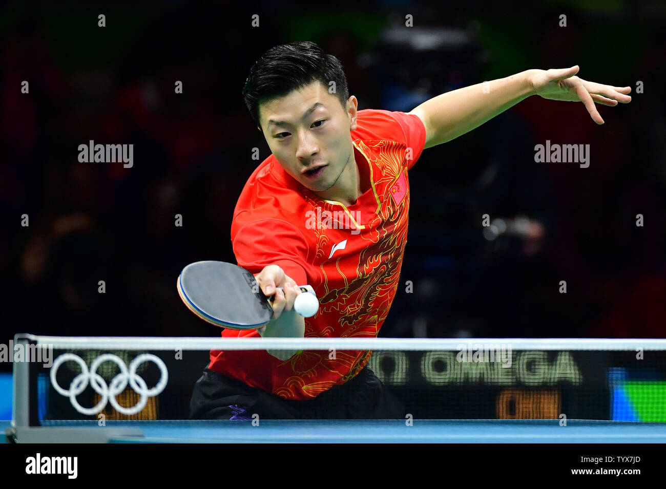 China's Ma Long competes against China's Zhang Jike in the Men's