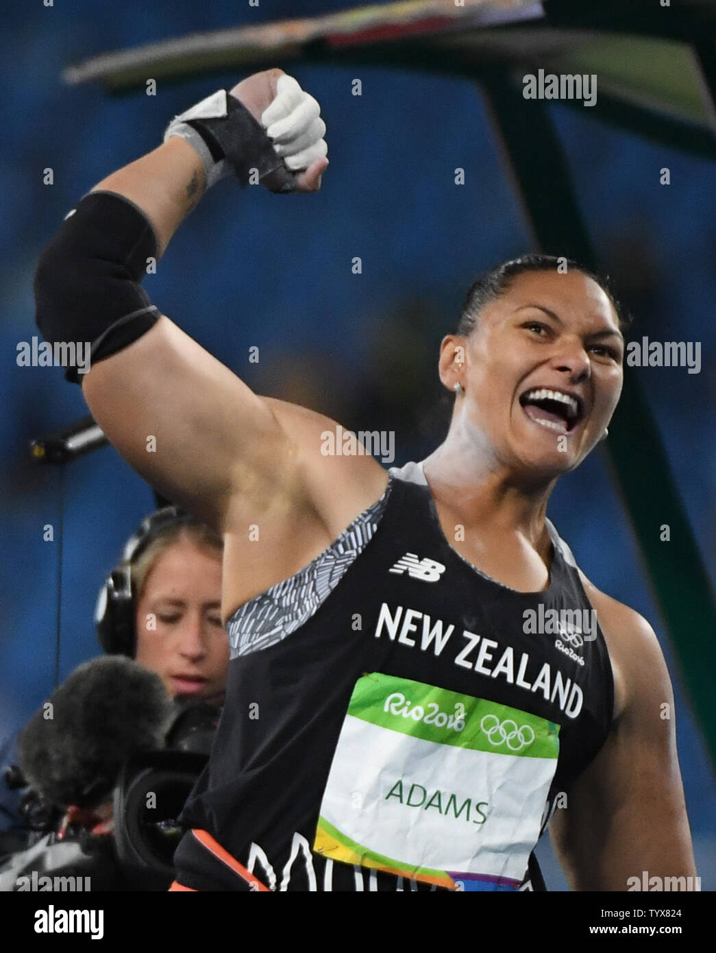 Valerie Adams of New Zealand reacts to taking the lead in the Women's