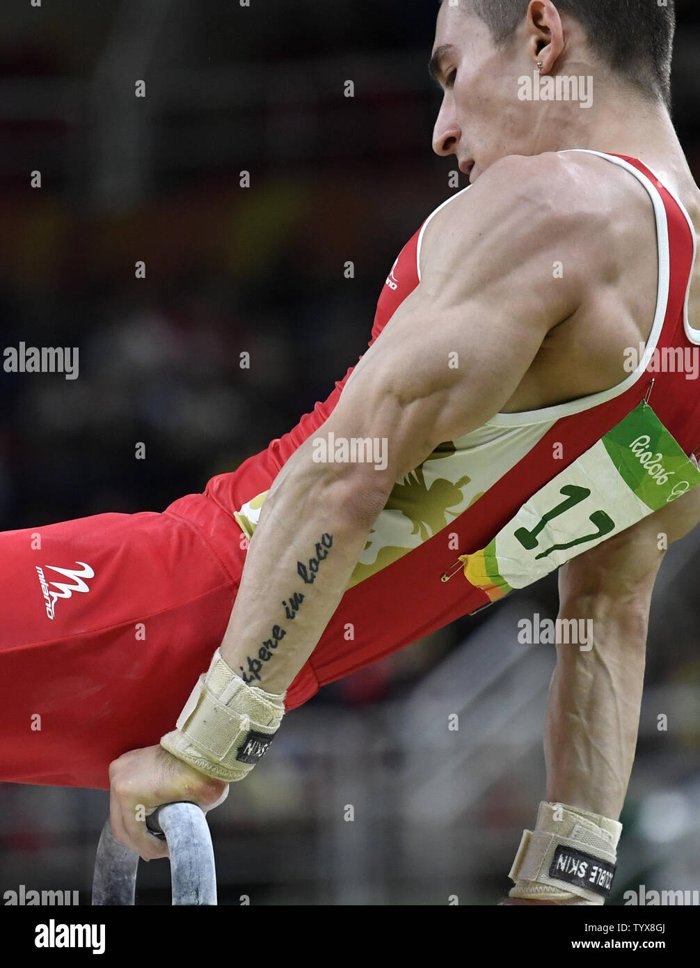 Russian Gymnast David Belyavskiy Sports A Tattoo On His Arm With The Latin Phrase Dolce Est Desipere In Loco Translated As It Is Sweet To Relax At The Proper Time As He
