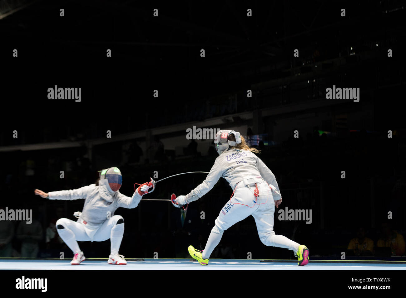 Fencer Mariel Zagunis of the United States, right, competes against Yana Egorian of Russia in the Women's Team Saber semifinals at Carioca 3 Arena at the 2016 Rio Summer Olympics in Rio de Janeiro, Brazil, on August 13, 2016.  The United States lost 45-42 to Russia and will now compete with Italy for the bronze medal.      Photo by Richard Ellis/UPI.. Stock Photo