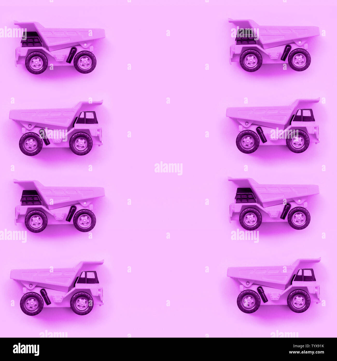 Many small purple toy trucks on texture background of fashion pastel ...