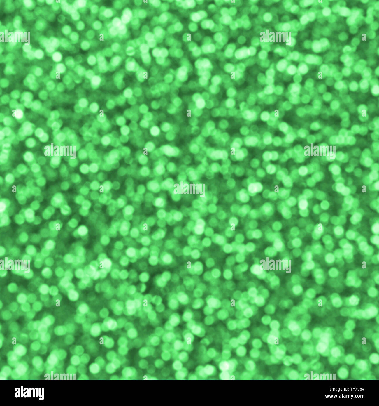 Blurred green decorative sequins. Background image with shiny bokeh ...