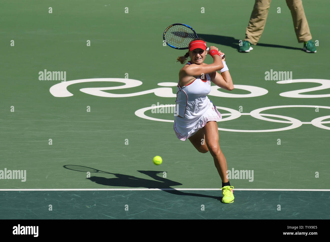 Ekaterina Makarova of Russia returns a volley during the gold medal