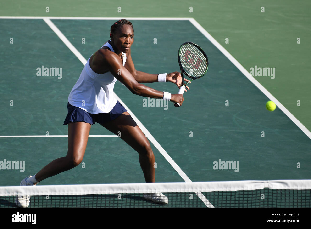 Venus Williams of the United States returns a volley during the Mixed Doubles Gold Medal Tennis Match at the Olympic Tennis Stadium at the 2016 Rio Summer Olympics in Rio de Janeiro, Brazil, on August 14, 2016.            Photo by Richard Ellis/UPI.. Stock Photo