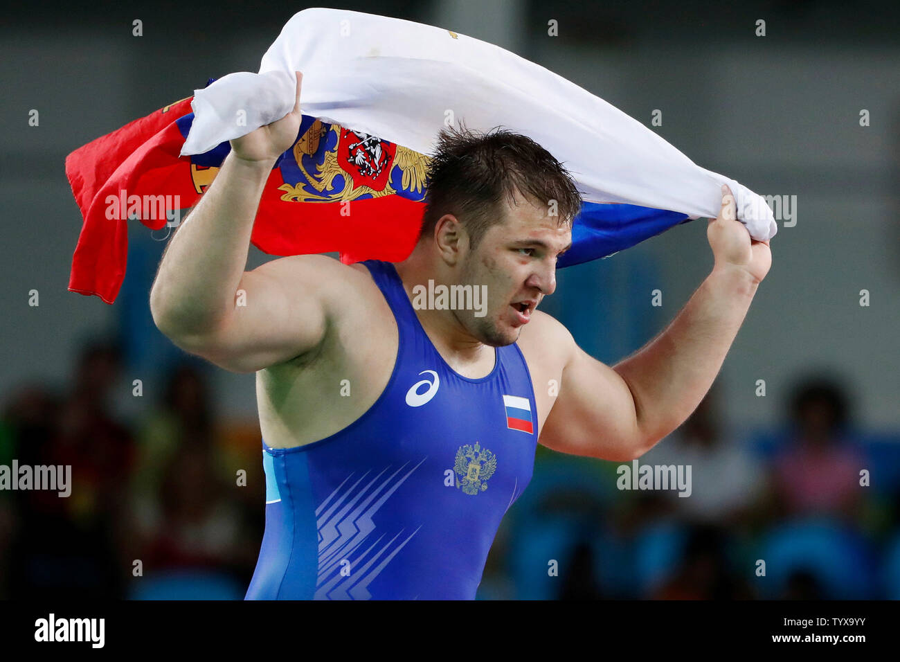 Russia's Sergey Semenov celebrates his bronze medal win over Estonia's