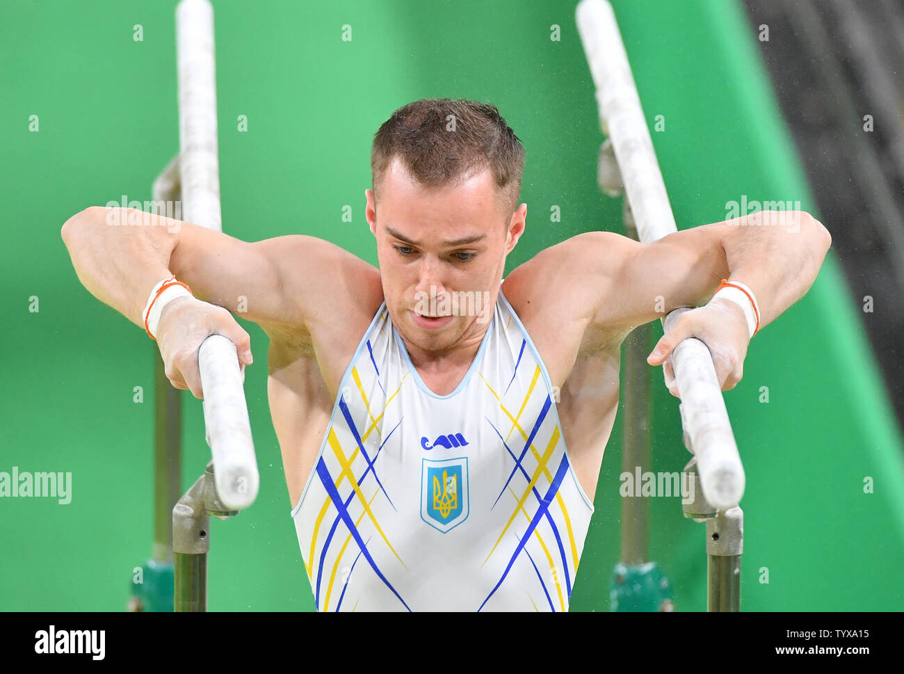 Oleg Verniaiev of Ukraine competes in the men's parallel bars event