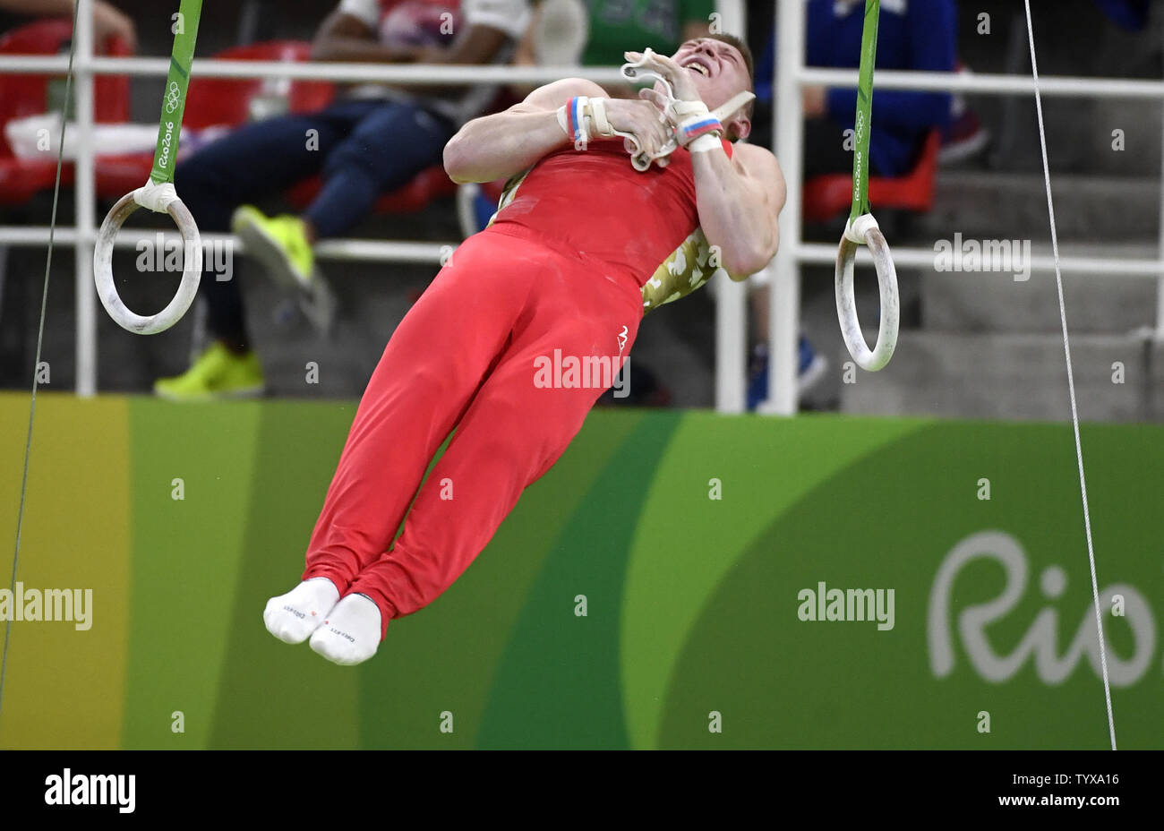 Russia's Denis Abliazin begins his dismount after his routine on the Rings during the Men's Rings Final at the 2016 Rio Summer Olympics in Rio de Janeiro, Brazil, August 15, 2016. Abliazin won the Bronze Medal as Greece's Eleftherios Petrounias won the Gold and Brazil's Arthur Zanetti won the Silver.      Photo by Mike Theiler/UPI Stock Photo