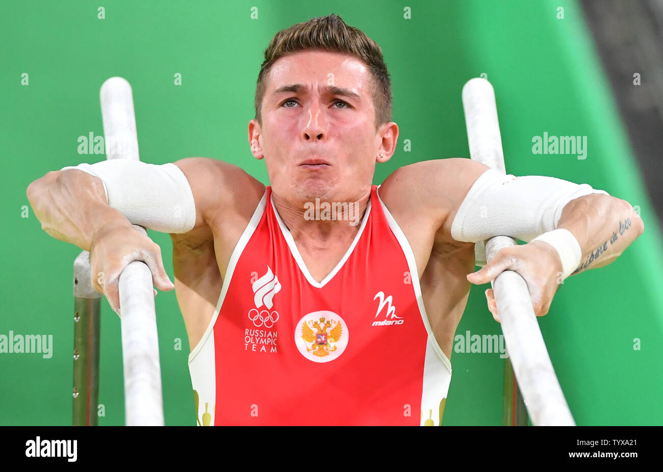 David Belyavskiy of Russia competes in the men's parallel bars event