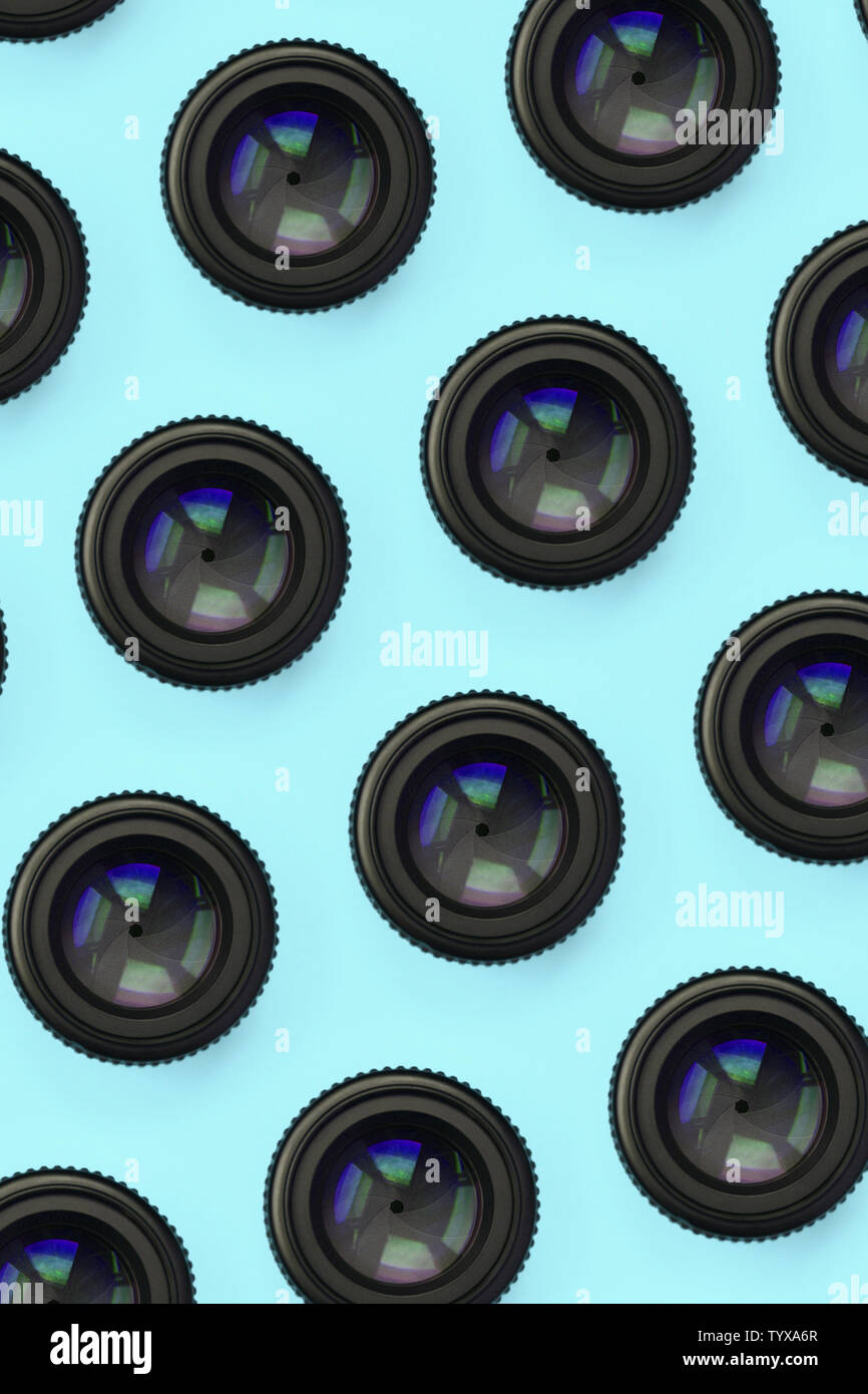 A few camera lenses with a closed aperture lie on texture background of  fashion pastel blue color paper in minimal concept. Abstract trendy pattern  Stock Photo - Alamy