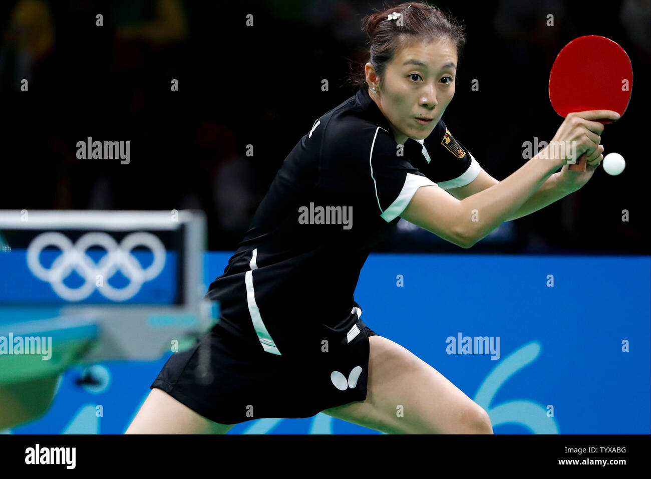 GermanyÕs Ying Han stretches for the ball in the Women's Team Table Tennis gold medal match against ChinaÕs Xiaoxia Li in Riocentro Pavilion 3 at the 2016 Rio Summer Olympics in Rio de Janeiro, Brazil, on August 16, 2016.   Photo by Matthew Healey/UPI Stock Photo