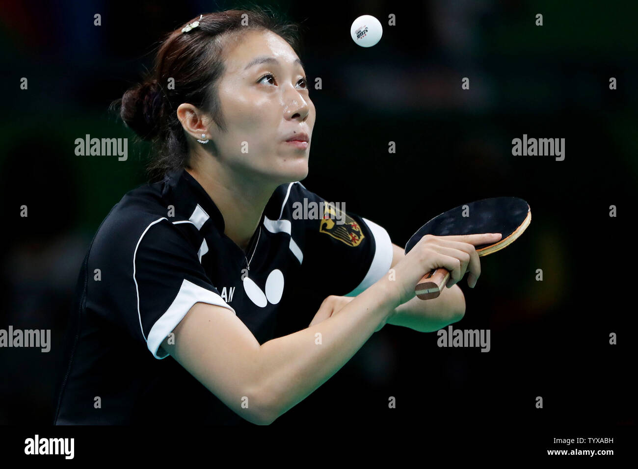 GermanyÕs Ying Han lines up a serve in the Women's Team Table Tennis gold medal match against ChinaÕs Xiaoxia Li in Riocentro Pavilion 3 at the 2016 Rio Summer Olympics in Rio de Janeiro, Brazil, on August 16, 2016.   Photo by Matthew Healey/UPI Stock Photo