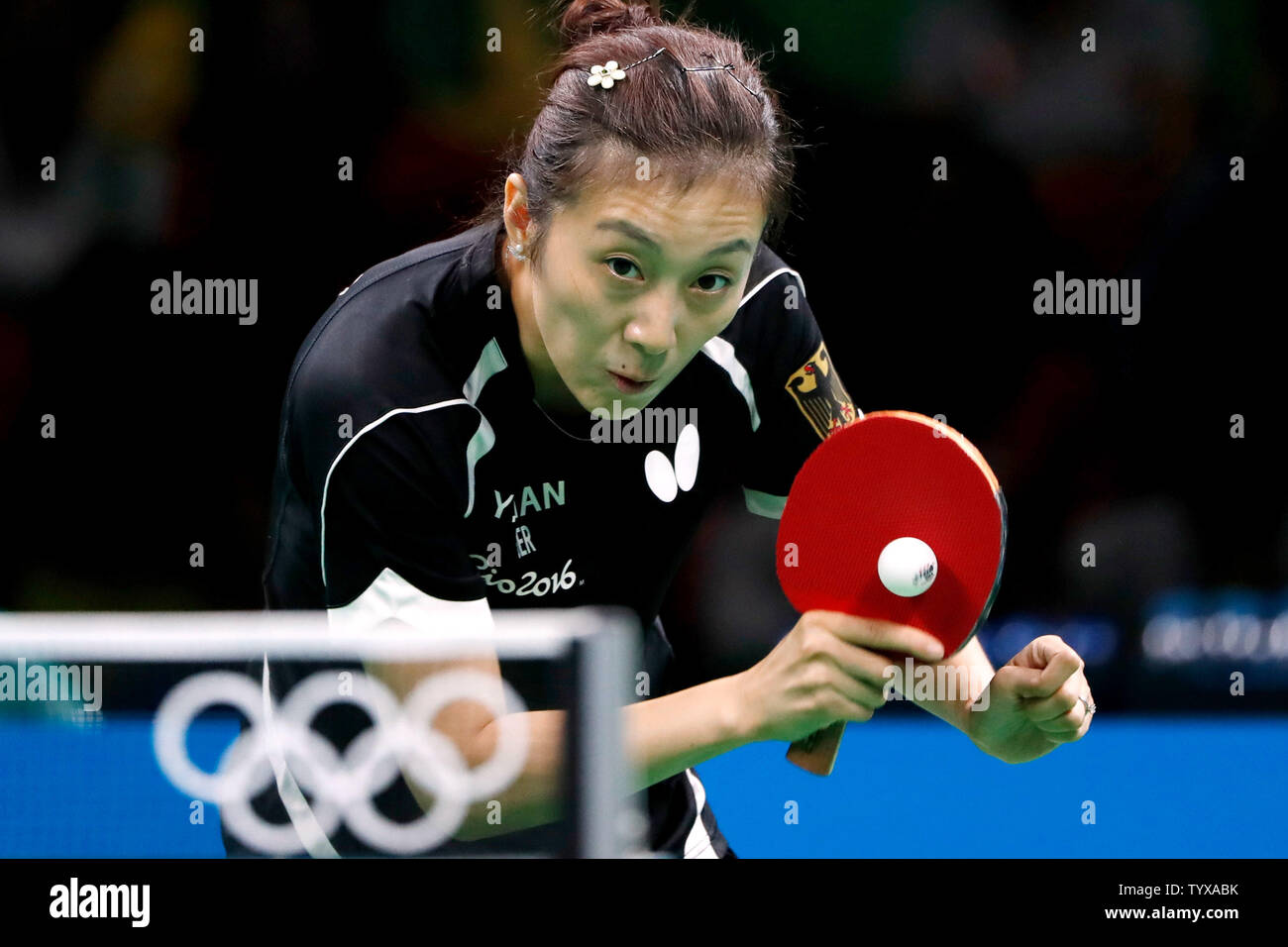 GermanyÕs Ying Han fires off a return in the Women's Team Table Tennis gold medal match against ChinaÕs Xiaoxia Li in Riocentro Pavilion 3 at the 2016 Rio Summer Olympics in Rio de Janeiro, Brazil, on August 16, 2016.   Photo by Matthew Healey/UPI Stock Photo