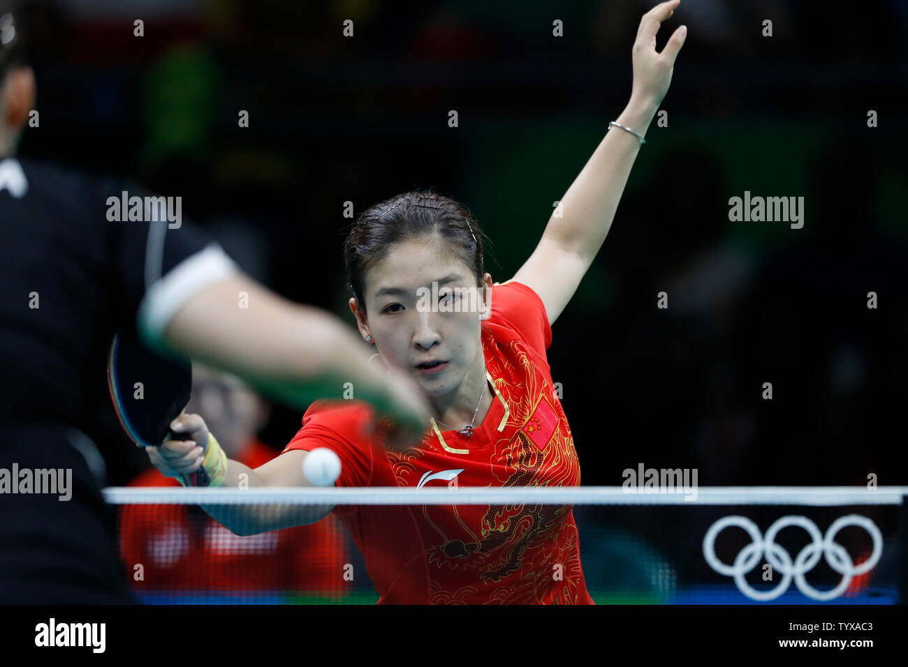 ChinaÕs Shiwen Liu (R) hits a return to GermanyÕs Petrissa Solja in the