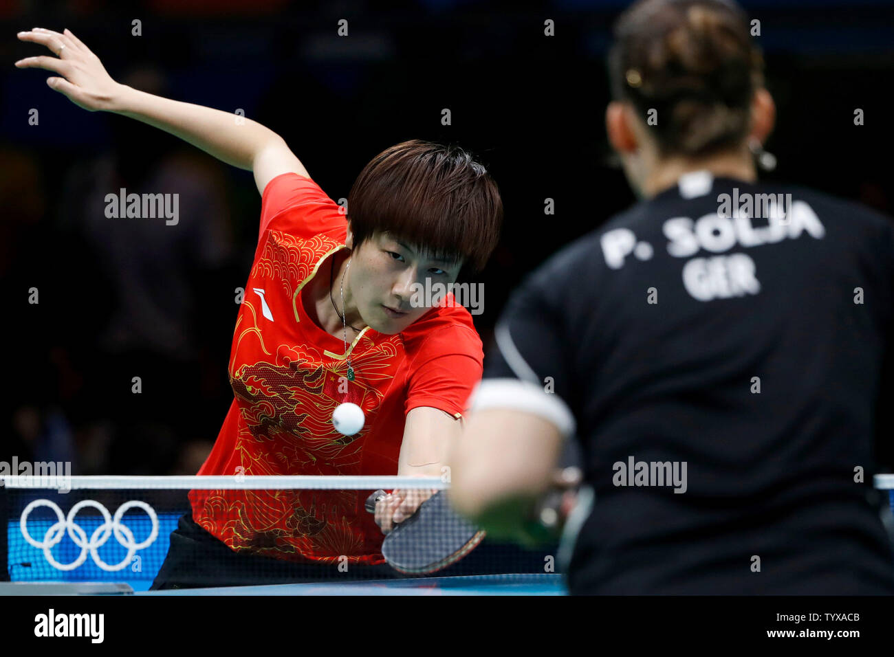 ChinaÕs Ning Ding returns a shot from GermanyÕs Petrissa Solja during ...