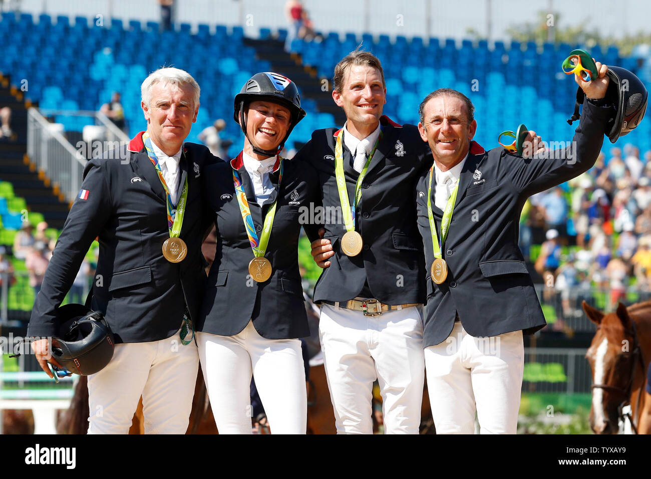 Team France poses with their gold medals for the Equestrian Jumping Team finals in the Olympic Equestrian Centre at the 2016 Rio Summer Olympics in Rio de Janeiro, Brazil, on August 17, 2016.   Photo by Matthew Healey/UPI Stock Photo